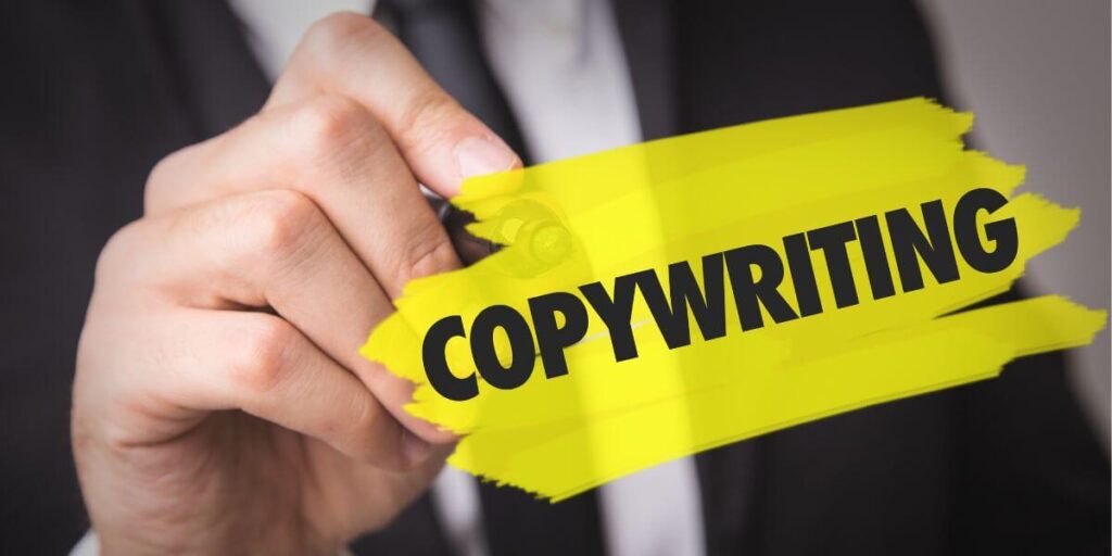 A person writing the word, 'copywriting'