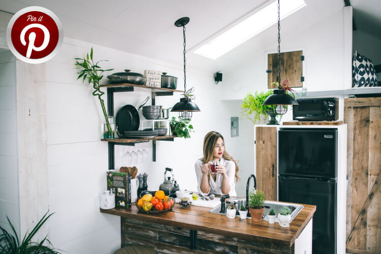 A woman sitting in her kitchen