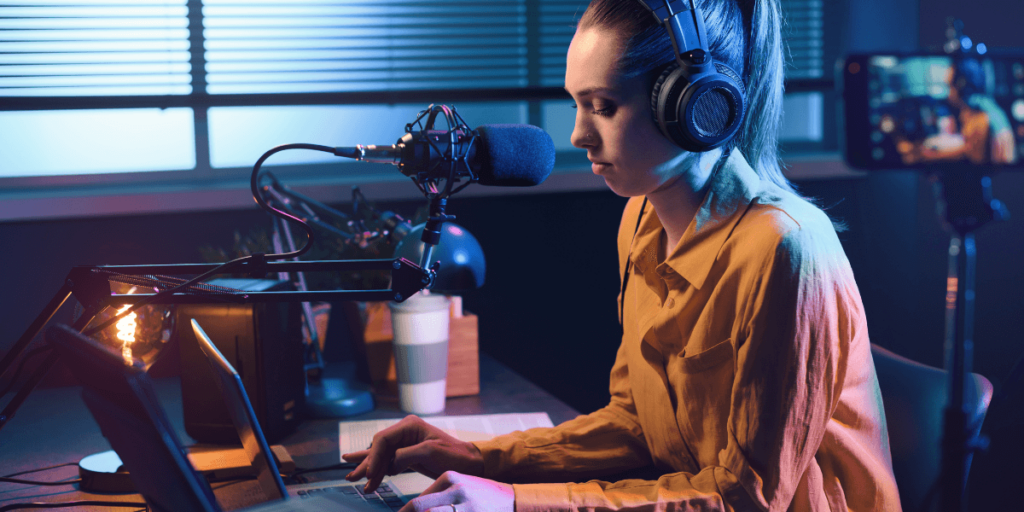 a woman filming on a laptop